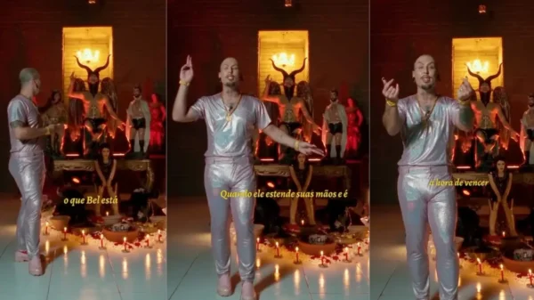 Satanista diante de imagens de belzebu